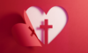 Heart shape with a cross in a red paper